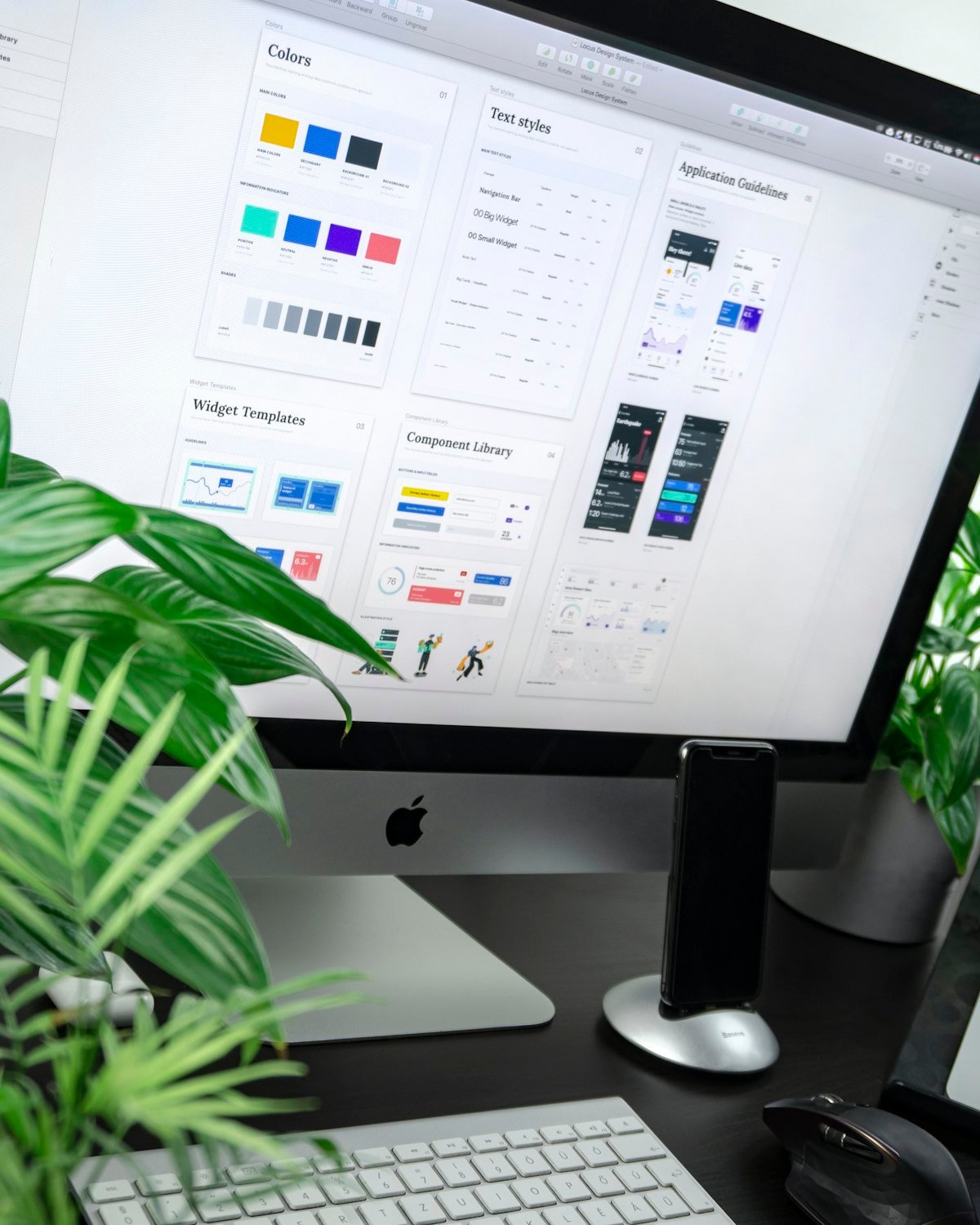 A computer screen displaying a website design system with a color palette, typography styles, and a component library